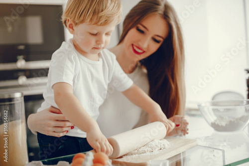 Family in a kitchen. Beautiful mother with little son