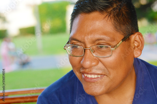 Obraz na plátně Happy native american man wearing glasses.