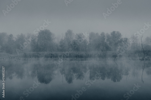 Mysterious fog on the river. Web banner.