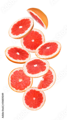 Flying cut grapefruit on white background