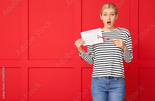 Surprised woman holding men...