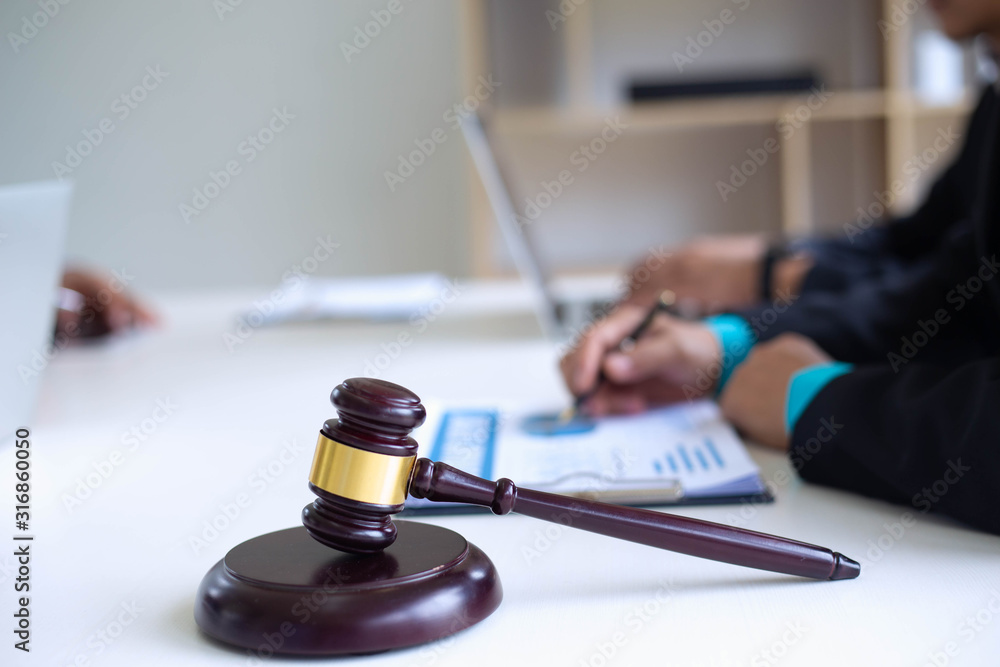 Lawyers are describing the sale transaction of a home sales project.Concepts of law Lawyers are describing the sale transaction of a home sales project.Concepts of law