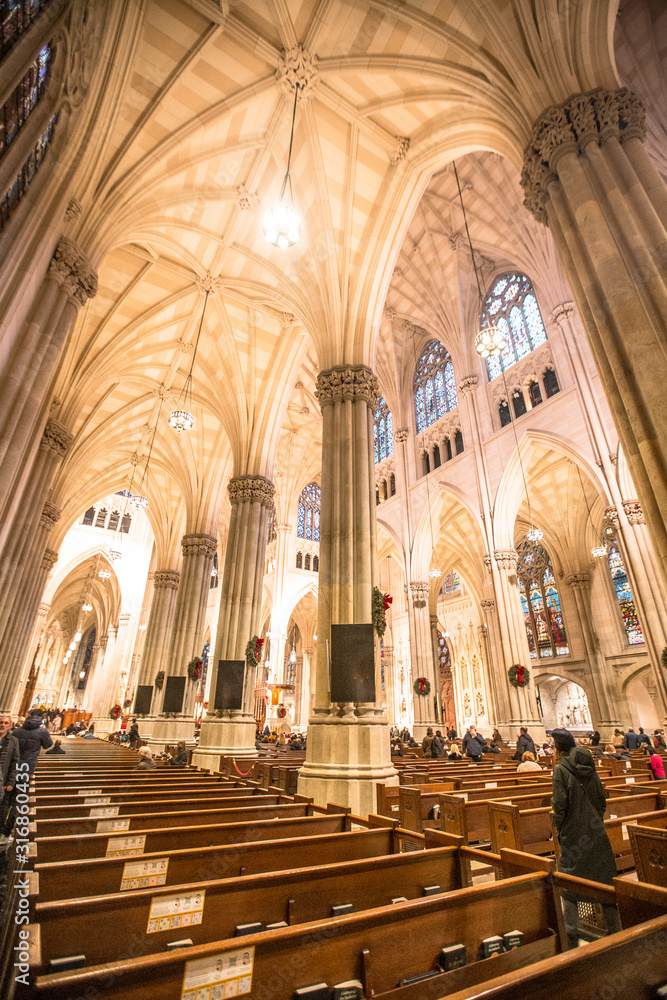New York, United States »; January 5, 2020: Interior seats in the St. Patrick's Neogothic Cathedral in New York style