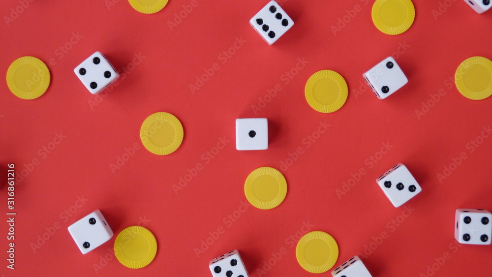 Flat Lay of Dice and Yellow Chips on a Red Background | Game Night Flat Lay of Dice and Yellow Chips on a Red Background | Game Night