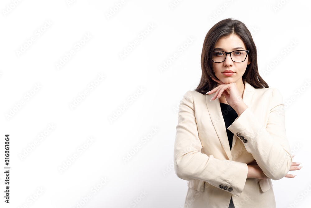 Thoughtful young cute businesswoman posing propping her chin isolated white background copyspace Thoughtful young cute businesswoman posing propping her chin isolated white background copyspace