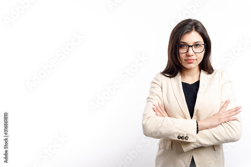 Smart female office clerk posing with arms crossed isolated white background copyspace
