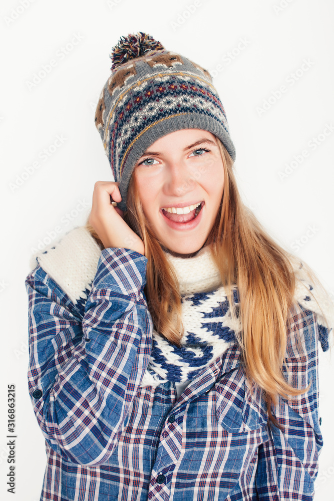 young pretty blond woman in hat and winter scarf smiling cheerful on white background, lifestyle people concept young pretty blond woman in hat and winter scarf smiling cheerful on white background, lifestyle people concept