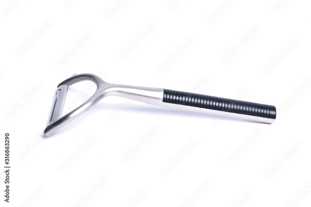Vegetable peeler metal isolated in different poses on white background Vegetable peeler metal isolated in different poses on white background