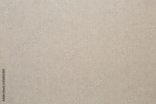 The texture of the book cover, beige.