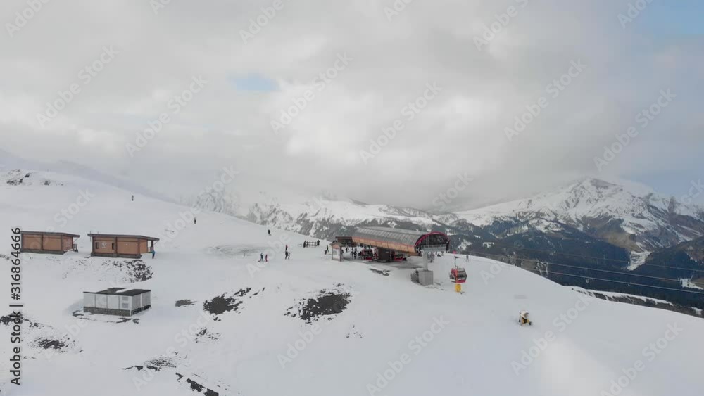 Aerial view snow covered mountains and ski resort. Aerial view snow covered mountains and ski resort.