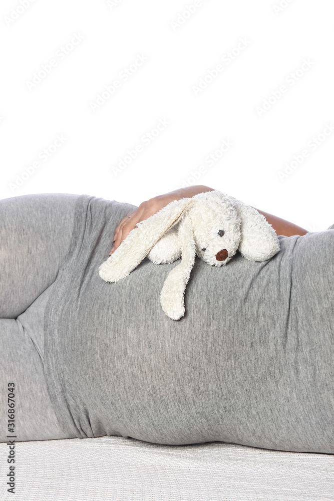 Happy pregnant girl lies on white background Happy pregnant girl lies on white background