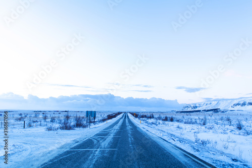 Picturesque winter landscape of Iceland. The perfect road to perspective © Kate