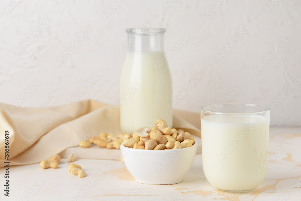 Cashew milk on white background Cashew milk on white background