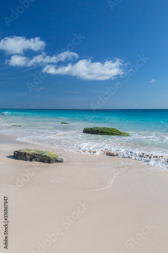Rocks on a sandy beach  on the island of Bermuda