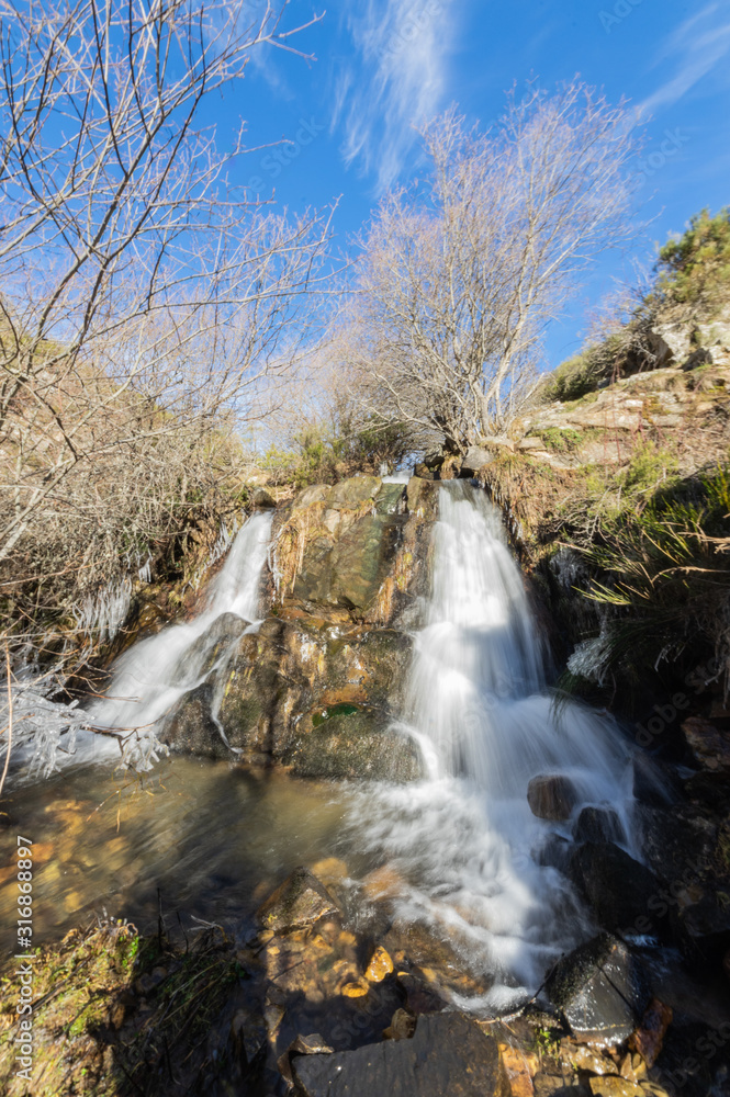 Small waterfall located at the end of Los Calderones hiking trail in Leon, Spain. Small waterfall located at the end of Los Calderones hiking trail in Leon, Spain.