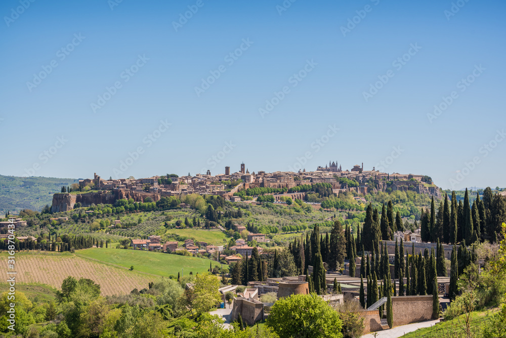 Panoramic view of Orvieto small vilage in Italy with red brick houses and towers and nature in Umbria Italy