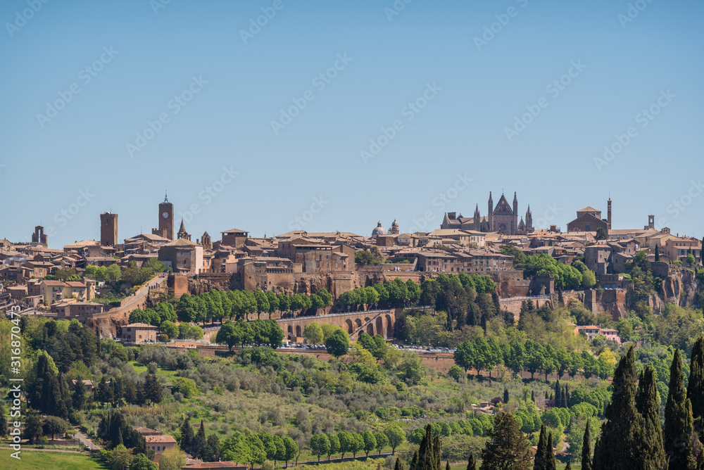 Panoramic view of Orvieto small vilage in Italy with red brick houses and towers and nature in Umbria Italy