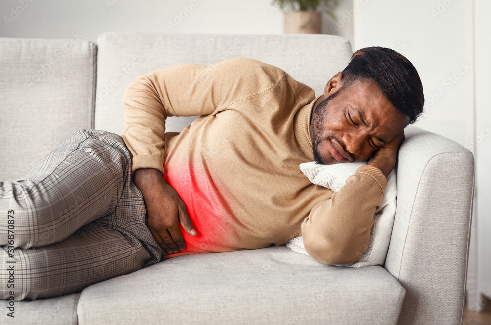 Guy Touching Stomach Red Pain Zone Lying On Sofa Guy Touching Stomach Red Pain Zone Lying On Sofa