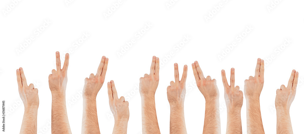 Fingers raised up on a light background. The concept of applying, willingness to ask questions. Hands raised up.