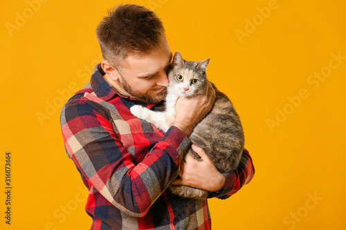 Man with cute cat on color ...