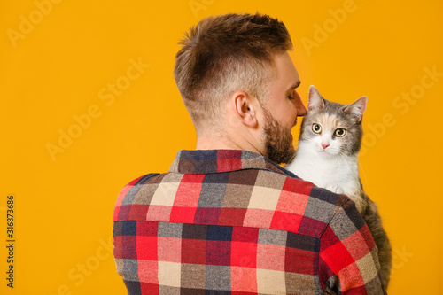 Man with cute cat on color ...