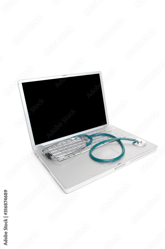 Laptop computer standing with blank screen open and stethoscope lying across the keyboard on white background Laptop computer standing with blank screen open and stethoscope lying across the keyboard on white background