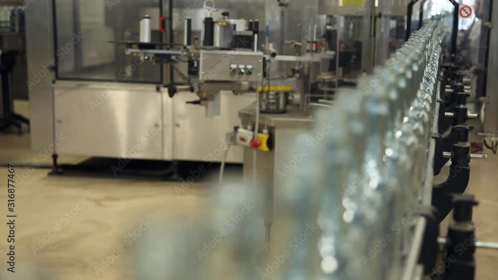Wine bottles in conveyor belt bottling line industry Wine bottles in conveyor belt bottling line industry