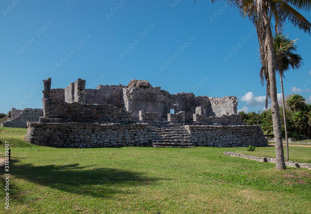 Tulum archaeological zone at noon in a sunny day