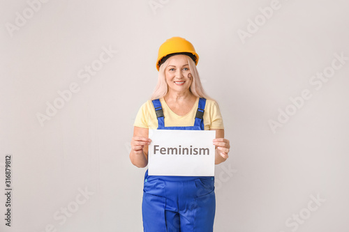 Female worker holding paper...