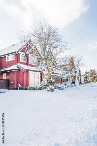 A perfect neighbourhood. Houses in suburb at Winter in the north America. Luxury houses covered nice snow. © karamysh