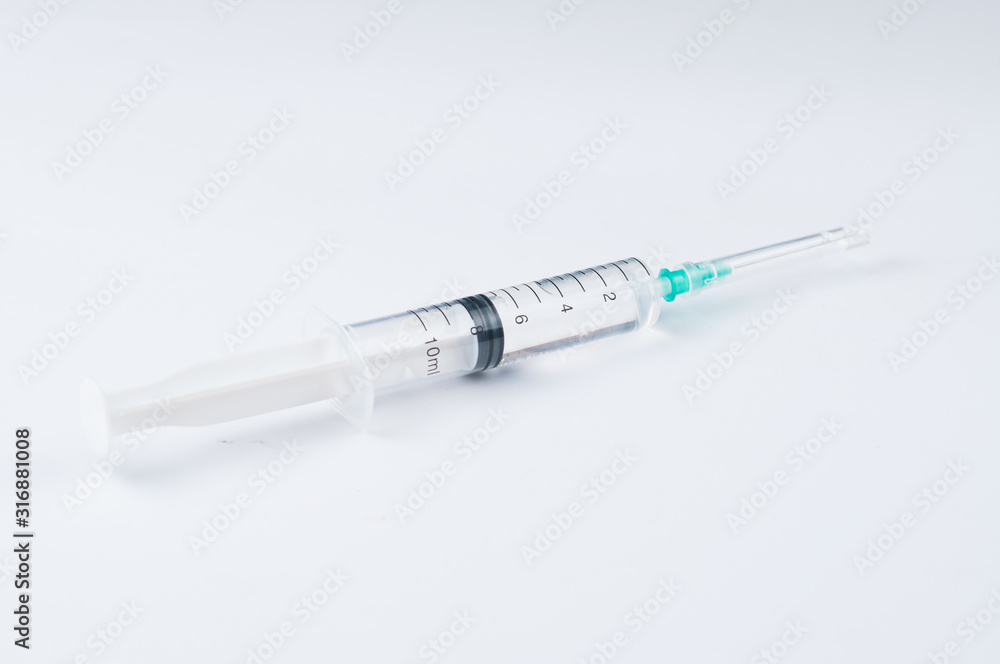 Syringe and needle isolated on white background.Copy space Syringe and needle isolated on white background.Copy space