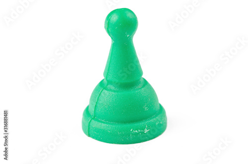 Green figure for ludo family board game isolated on the white background. Copy space.