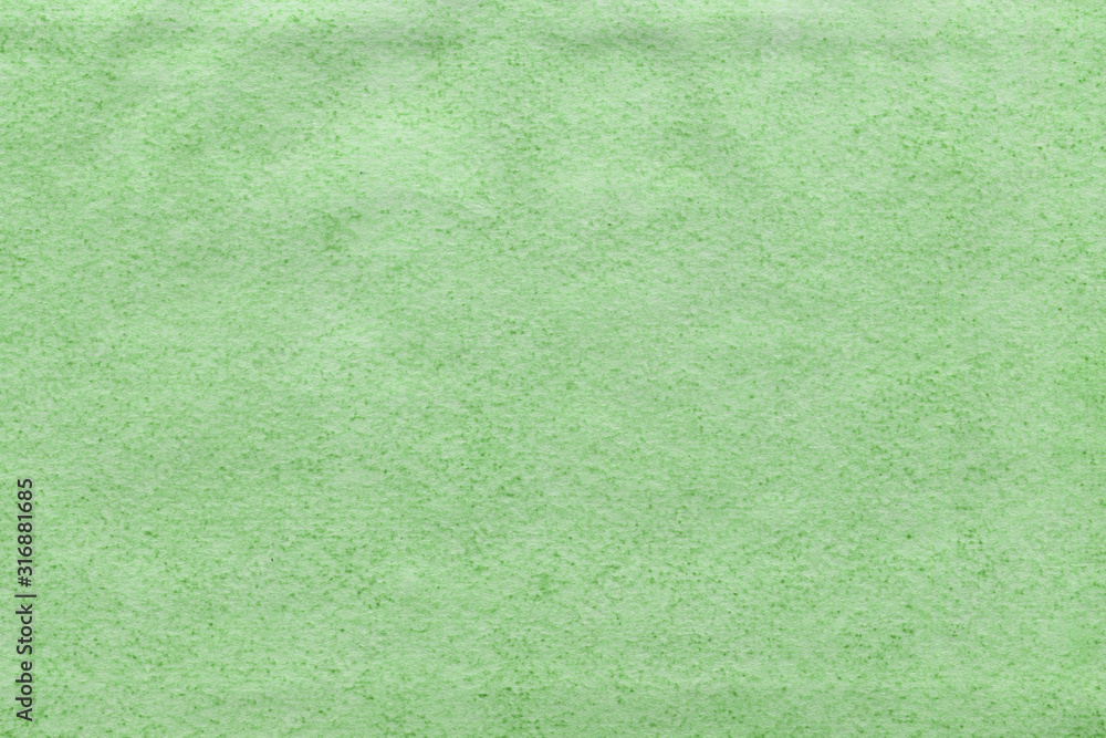 Fototapeta premium Cardboard green abstract pattern texture close-up. Retro old paper background. Grunge concrete wall. Vintage blank wallpaper.