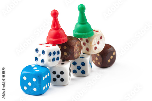 Colorful figures and dices of ludo family board game isolated on  white background. Copy space.