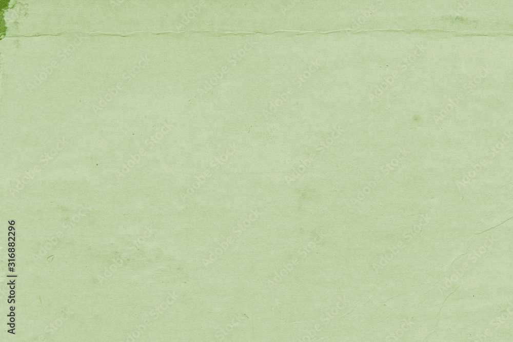 Cardboard green abstract pattern texture close-up. Retro old paper background. Grunge concrete wall. Vintage blank wallpaper. Cardboard green abstract pattern texture close-up. Retro old paper background. Grunge concrete wall. Vintage blank wallpaper.