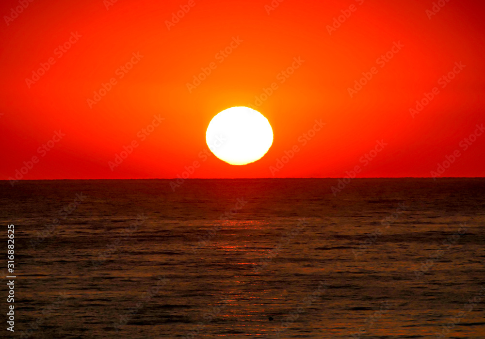 big sun over sea