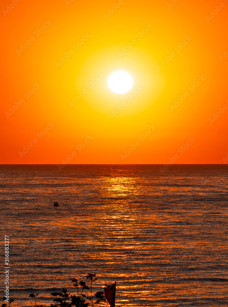 big sun over sea