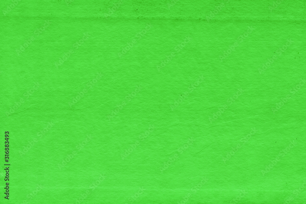 Fototapeta premium Cardboard green abstract pattern texture close-up. Retro old paper background. Grunge concrete wall. Vintage blank wallpaper.