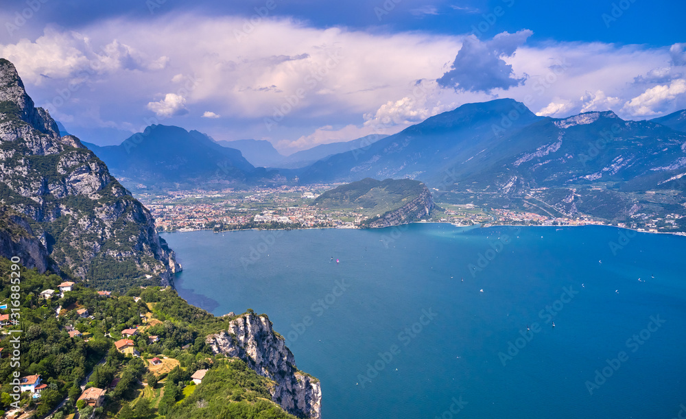 Panoramic view of the beautiful Lake Garda and Riva del Garda town in the summer time , Trentino Alto Adige region,Italy