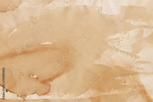 Vintage and old looking coffee cup stain background. Painted with a tea retro texture. Grunge paper for drawing. Ancient book page.
