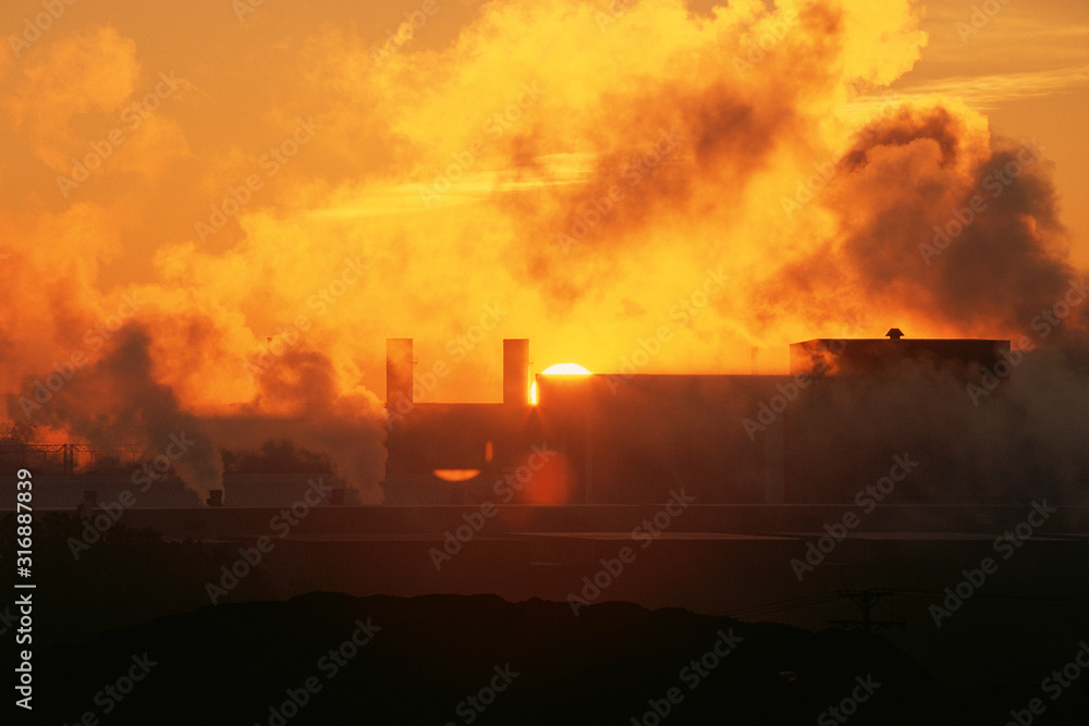 Sunrise at industrial plant