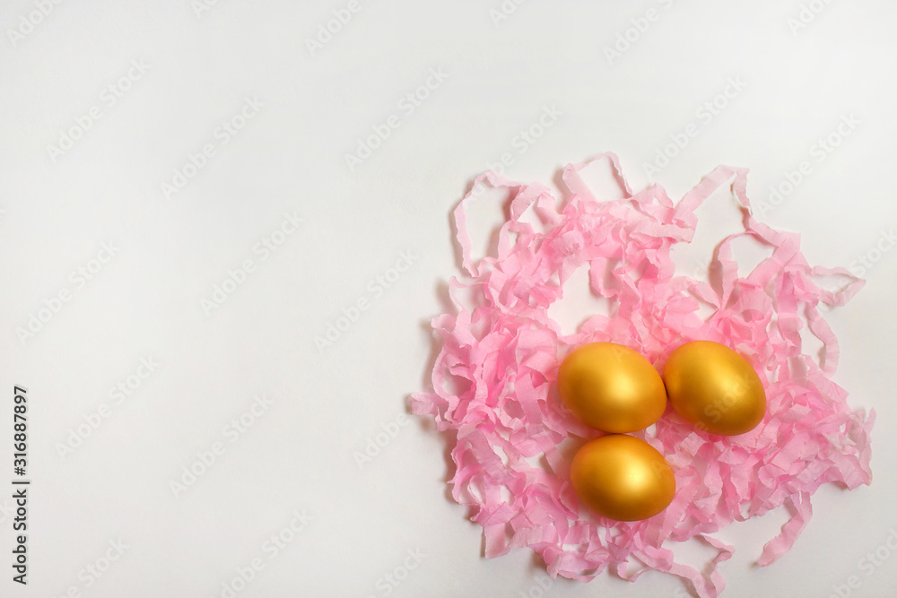 Golden quail eggs on a serpentine on a white background, free space for text or advertising