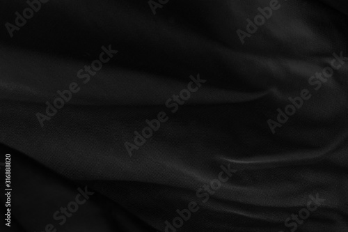 Black fabric sheets background or texture.