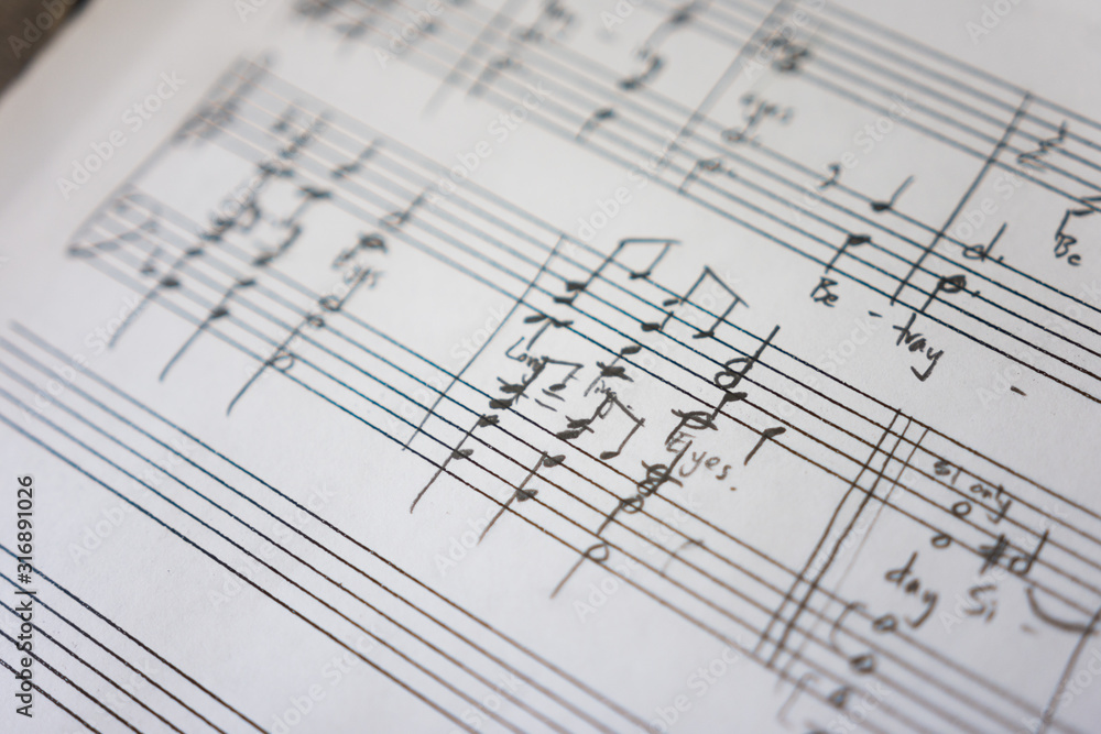 Handwritten sheet music on clean white paper Handwritten sheet music on clean white paper