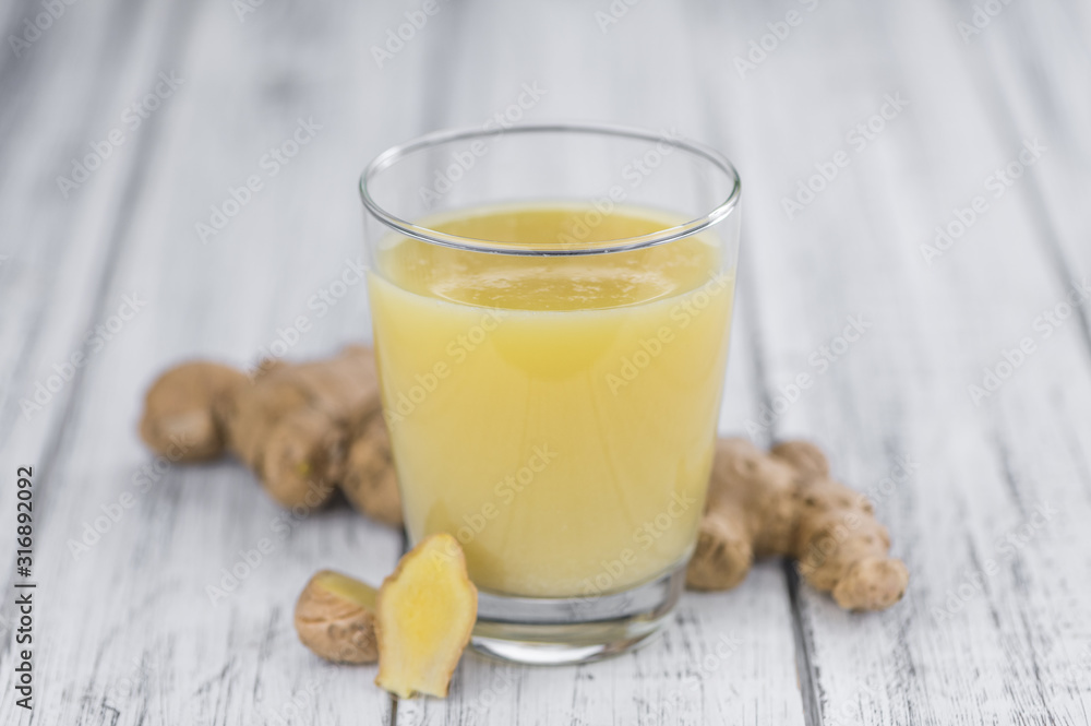 Portion of Ginger Juice as detailed close-up shot; selective focus Portion of Ginger Juice as detailed close-up shot; selective focus