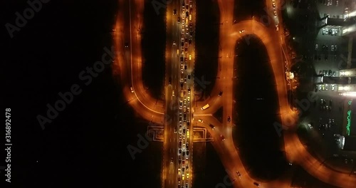 4K Aerial Top Drone View: Accident and traffic jam on the bridge in the evening after a working day. A huge number of cars on the road at rush hour. Downtown, city central part. Camera looks down.