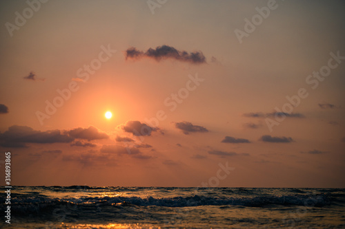 Beautiful sunset above sea. © nattanan