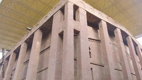 Tilt down view of rear exterior of Bet Medhane Alem rock-hewn church in Lalibela, Ethiopia photo