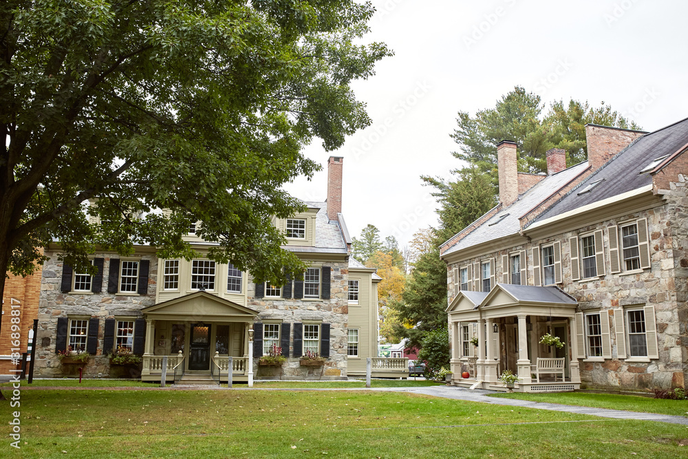 Obraz premium Residential neighborhood with historic homes on a Fall day in the New England town of Woodstock, Vermont