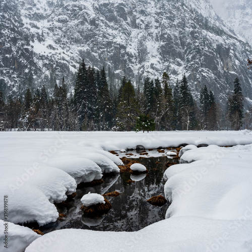 Creek Cuts Through Snow Covered Meadow